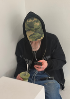 Model wearing the camo field cap